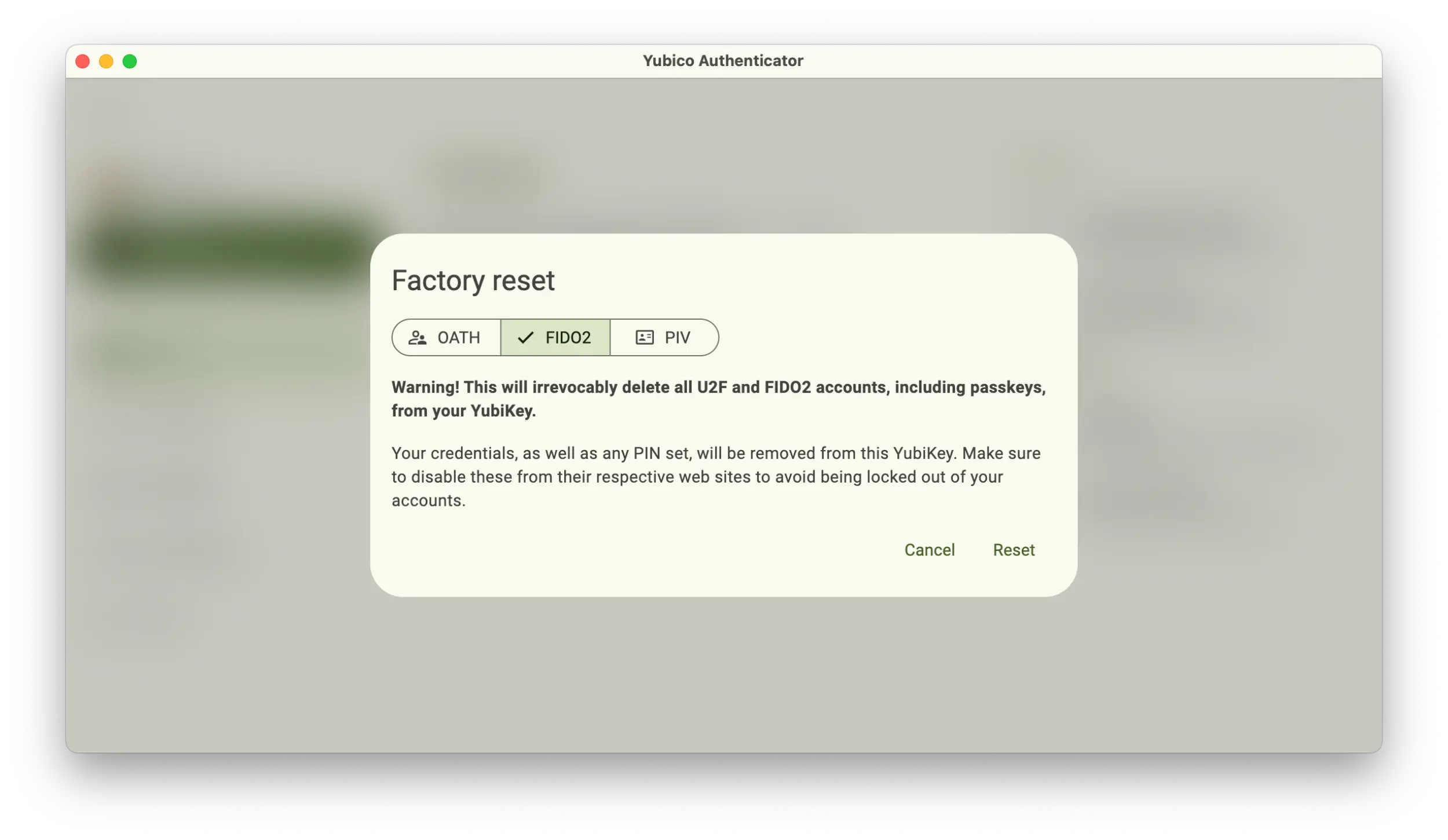 Screenshot of the Yubico Authenticator application showing Factory reset popup with the FIDO2 option selected.