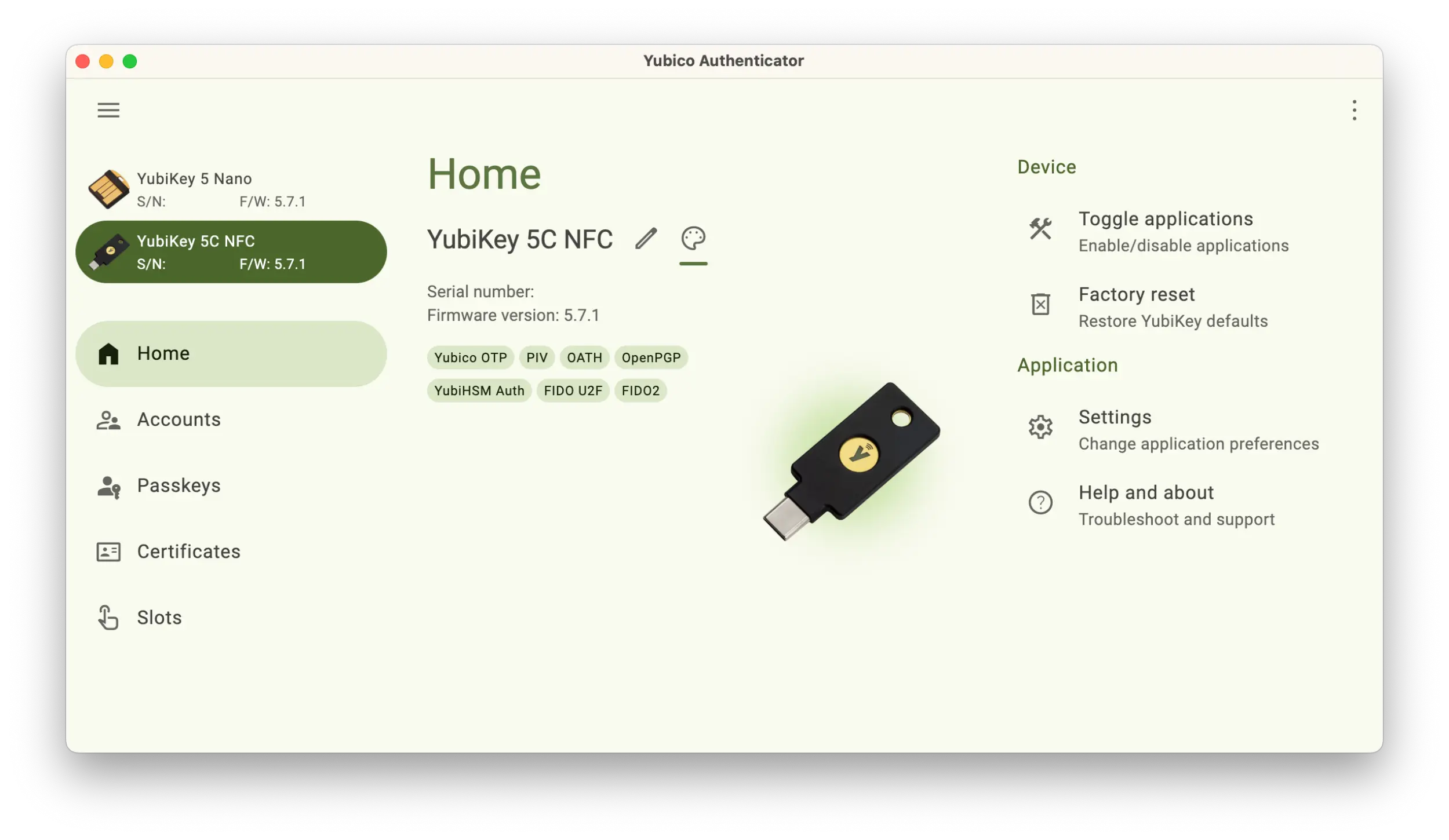 Screenshot of the Yubico Authenticator application showing a Home menu and 2 YubiKeys plugged in. The application window showing the main YubiKey is colored green.