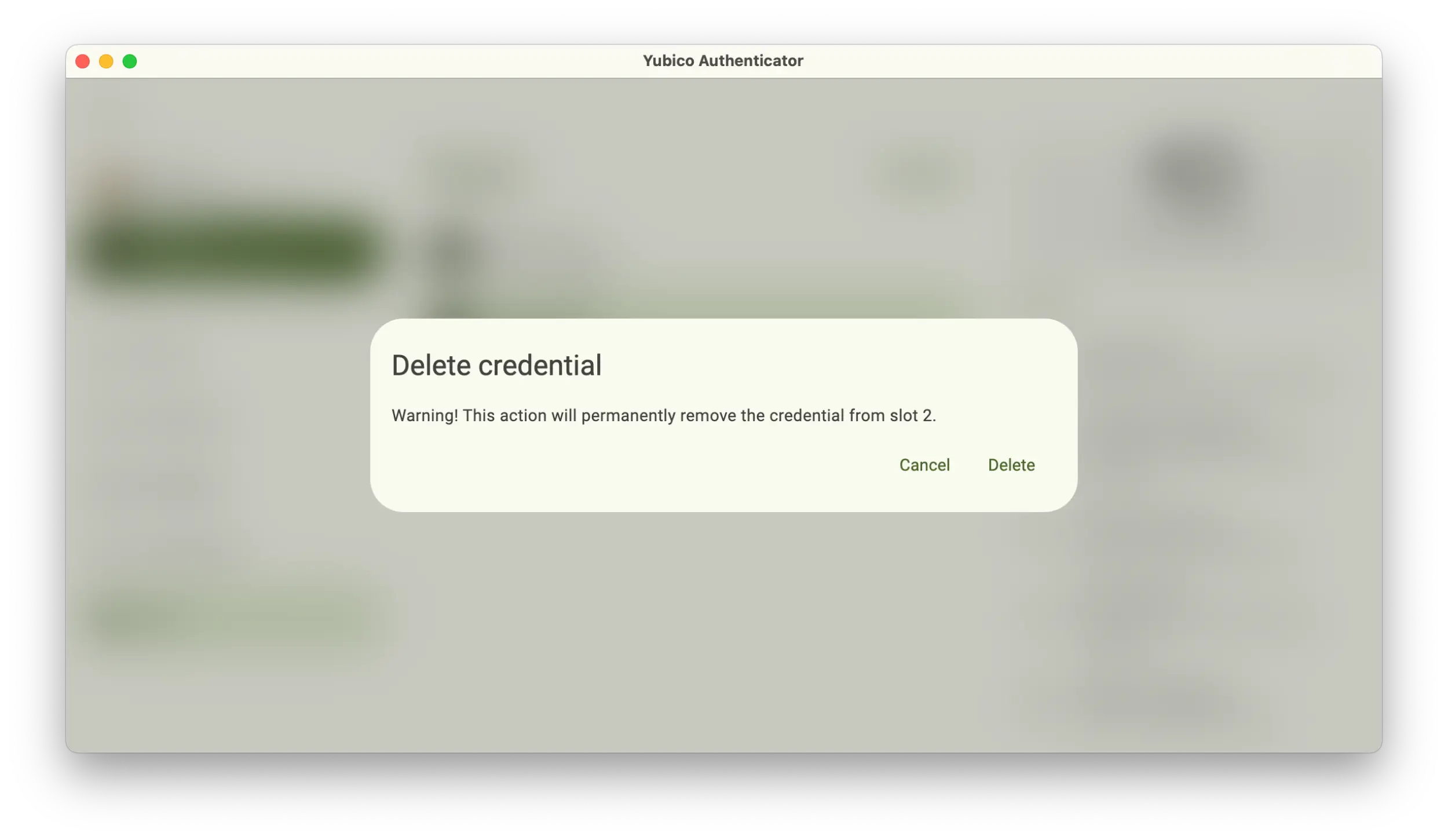 Screenshot of the Yubico Authenticator application showing a Delete credential popup.