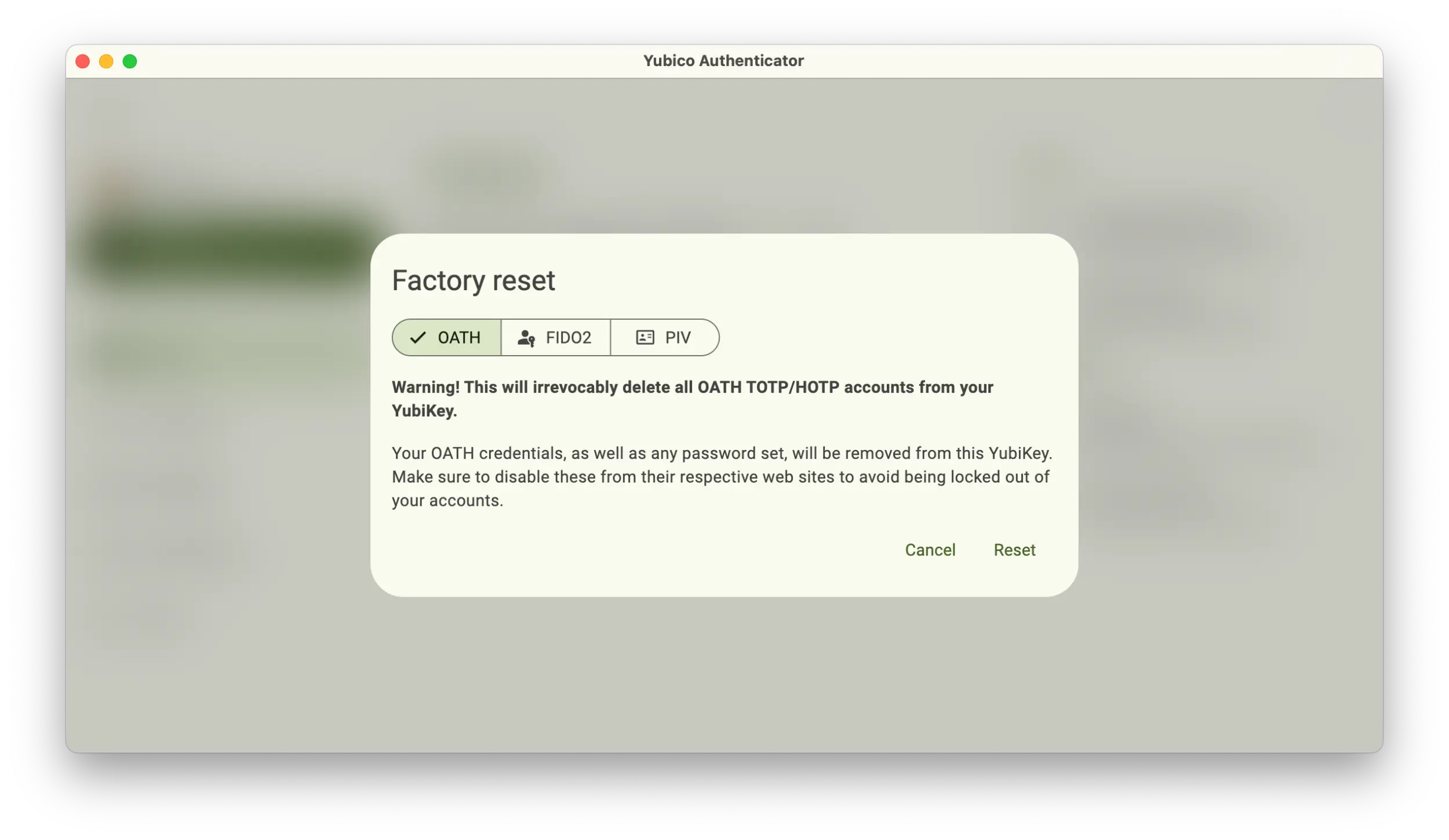 Screenshot of the Yubico Authenticator application showing a Factory reset popup with the OATH option selected.